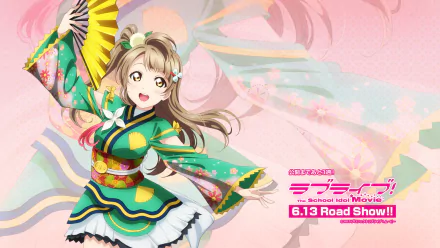 HD anime wallpaper featuring Kotori Minami from Love Live! in a vibrant green and yellow traditional outfit holding a fan, set against a soft pink background with floral accents.