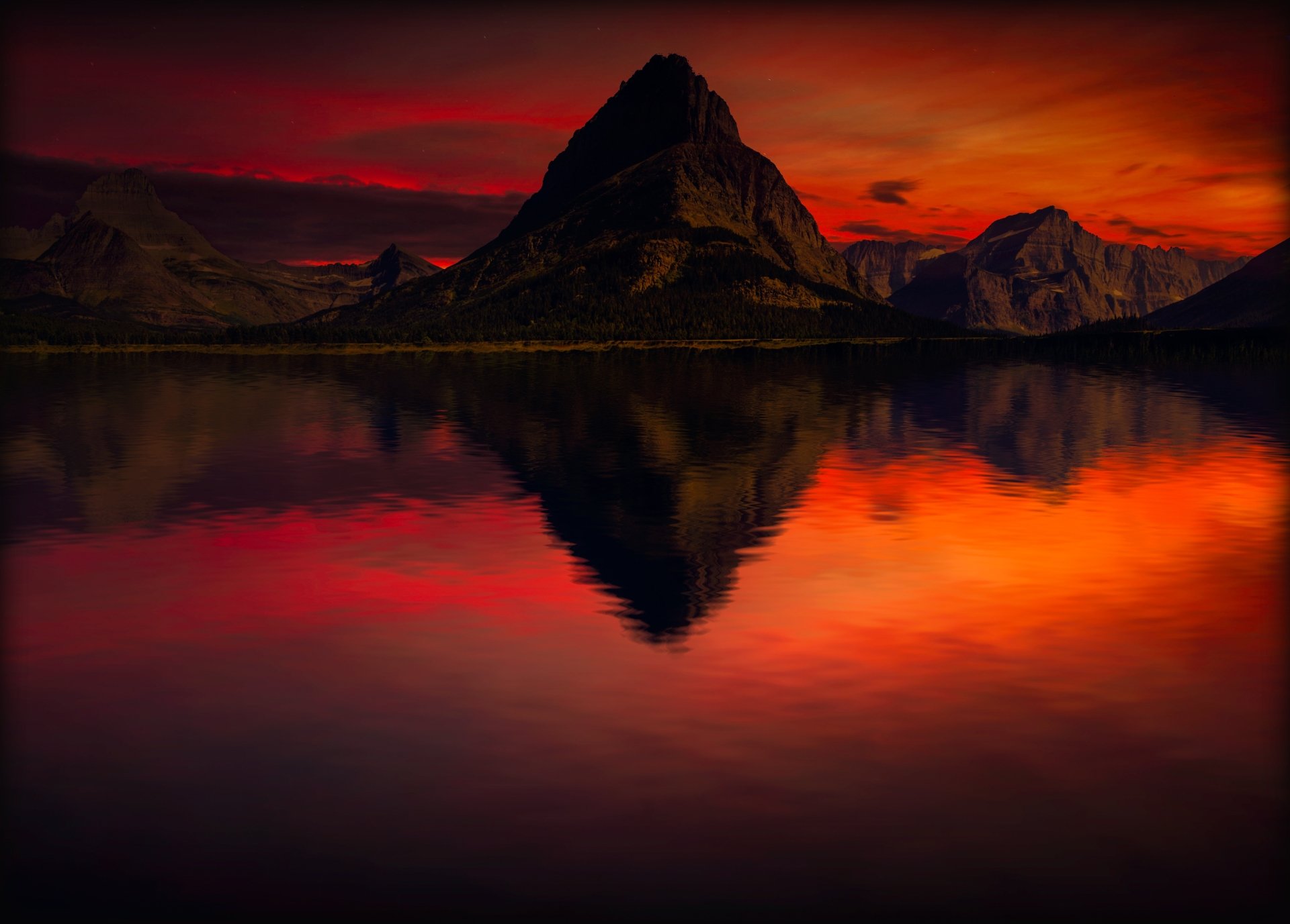4K Ultra HD PC desktop wallpaper: orange sunset behind a mountain peak mirrored in a calm lake, vivid nature background.