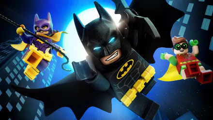 HD wallpaper featuring Lego versions of Batman, Batgirl, and Robin from The Lego Batman Movie, highlighting characters Barbara Gordon and Dick Grayson in an action-packed night scene above a city.