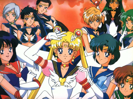 HD PC desktop wallpaper featuring vibrant anime characters from Sailor Moon in dynamic poses against a warm, glowing background.