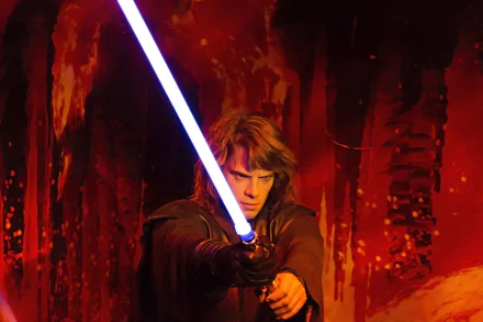 HD desktop wallpaper featuring Anakin Skywalker wielding a blue lightsaber against a fiery red background in a sci-fi Star Wars setting.