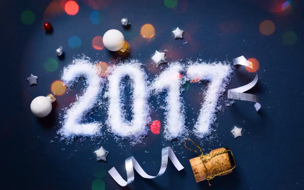 A festive 4K Ultra HD New Year 2017 desktop wallpaper featuring sparkling white powder forming 2017 with holiday decorations and colorful bokeh lights.