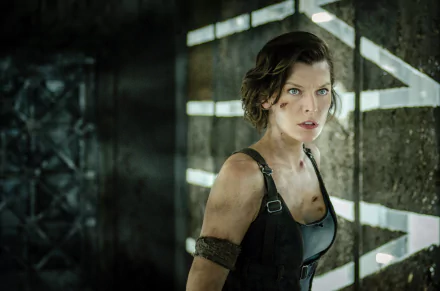 A high-definition desktop wallpaper featuring Milla Jovovich as Alice from the movie Resident Evil: The Final Chapter, showcasing her intense expression in a dramatic, dimly lit setting.