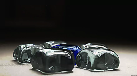 Artistic blue crystal pentagon arrangement on a dark surface, high-detail 5K Ultra HD PC desktop wallpaper background with reflective stones and dramatic lighting.