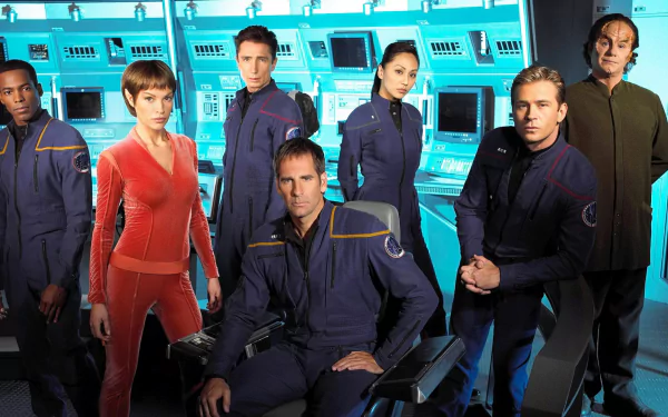 Star Trek: Enterprise TV show HD PC desktop wallpaper — uniformed bridge crew posed at ship consoles under cool blue lighting.