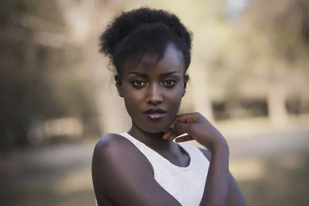 Portrait of a woman with black hair and brown eyes, captured with a shallow depth of field, featured in HD as a PC desktop wallpaper and background.