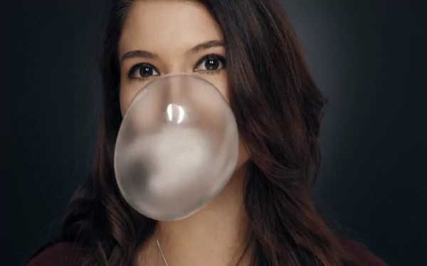 chewing gum brown eyes brunette model woman face HD Desktop Wallpaper | Background Image