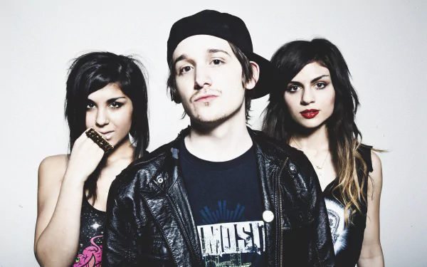 High-resolution 4K Ultra HD desktop wallpaper featuring the music group Krewella with two women and one man posing against a plain background.