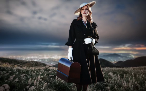 Kate Winslet stands with a suitcase at sunset in a melancholic scene from the movie The Dressmaker, captured in stunning 4K Ultra HD wallpaper quality.