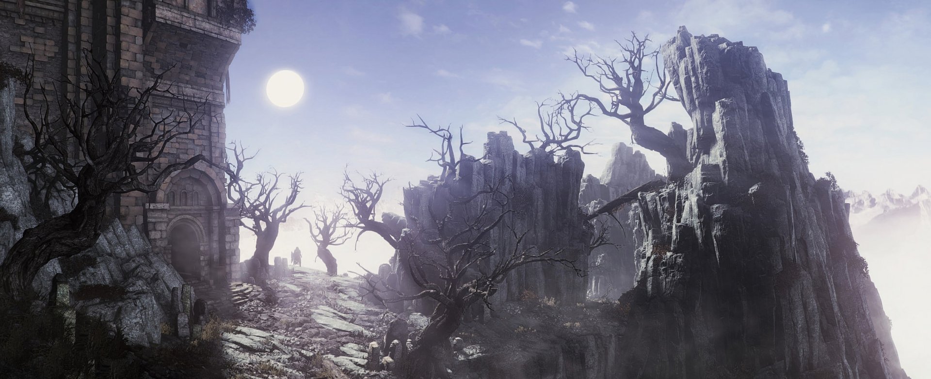 HD PC desktop wallpaper from the video game Dark Souls III, depicting a desolate landscape with rocky cliffs, bare twisted trees, and a bright sun in the sky.