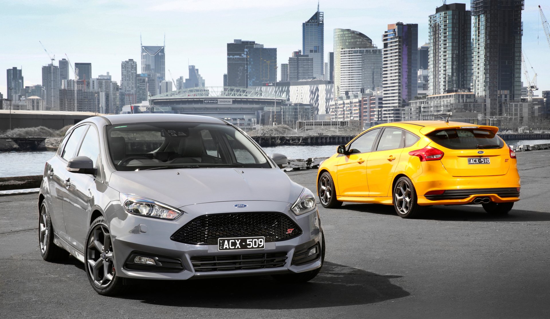 Download Australia Melbourne Yellow Car Silver Car Car Compact Car Ford Vehicle Ford Focus HD Wallpaper