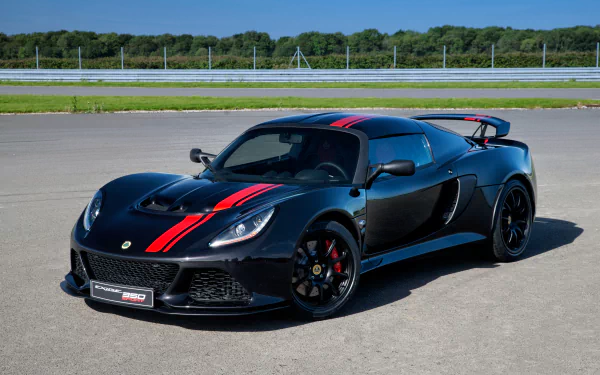 A striking HD desktop wallpaper featuring a 2017 Lotus Exige 350 Special Edition. The black supercar, with red racing stripes, sits on a smooth track with greenery and a blue sky in the background.