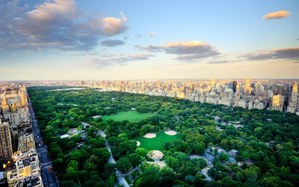 Aerial view of Central Park surrounded by skyscrapers in New York City, USA, captured in high definition for a desktop wallpaper background.