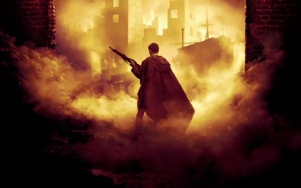 HD PC desktop wallpaper from the movie Enemy At The Gates, showing a lone soldier holding a rifle amidst smoke and a fiery, war-torn urban backdrop.
