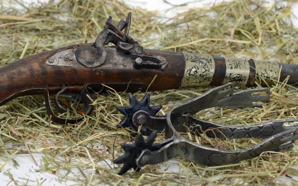  Antique pistol and Spurs
