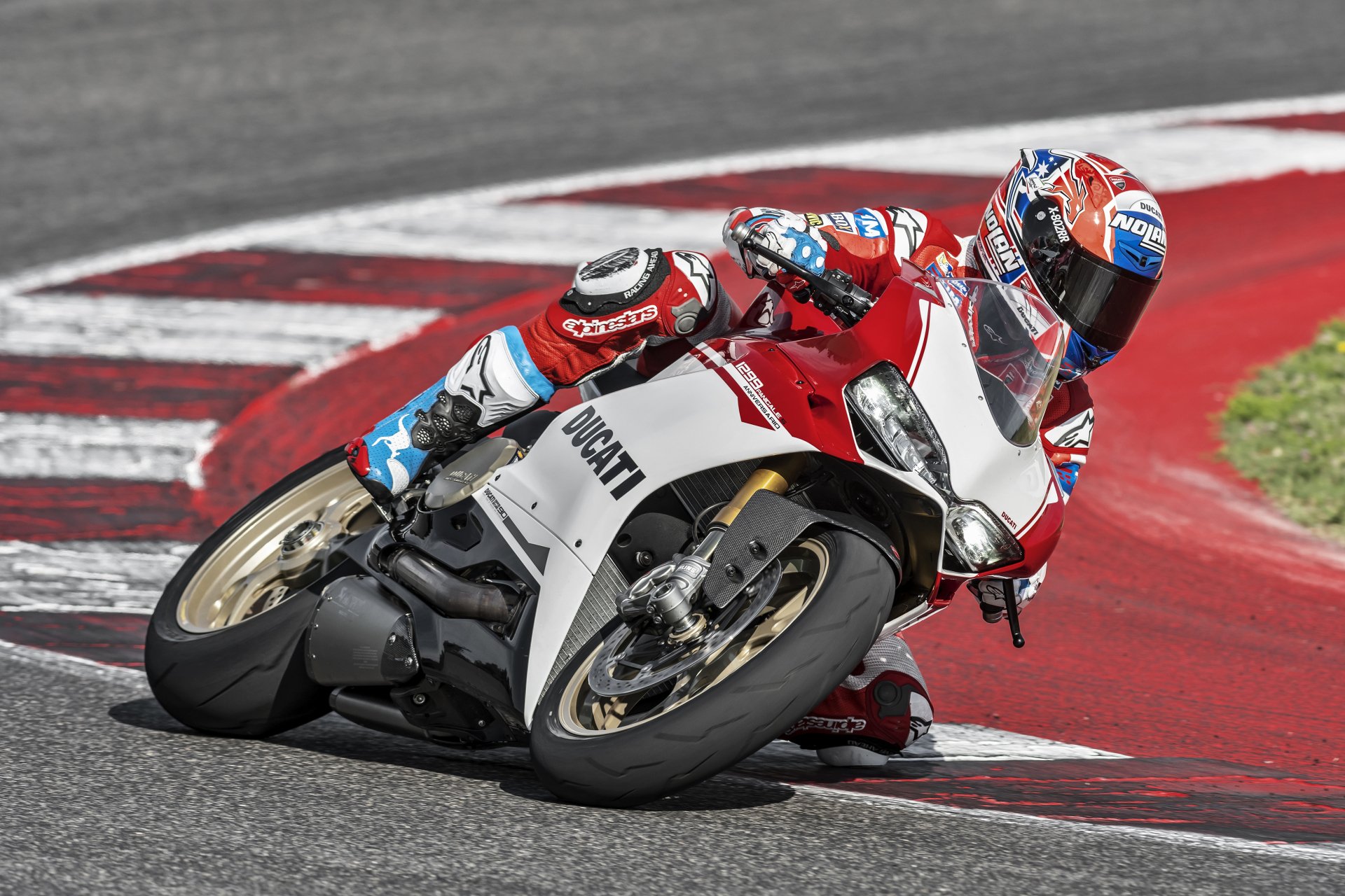 Rider on a white-and-red Ducati 1299 leaning into a racetrack corner; dynamic 4K Ultra HD PC desktop wallpaper of a Ducati motorcycle in motion.