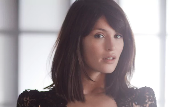 HD desktop wallpaper featuring brunette actress and celebrity Gemma Arterton in soft natural light.