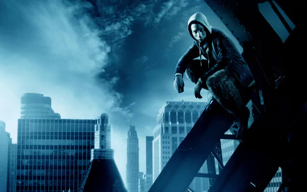 HD PC desktop wallpaper from Percy Jackson & the Olympians: The Lightning Thief — hooded hero perched on a steel rooftop beam above a blue-tinted city skyline.