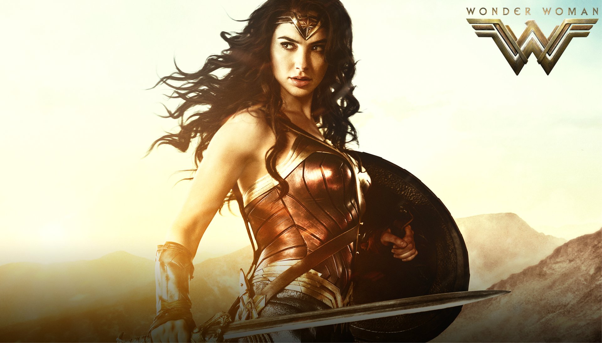 HD desktop wallpaper featuring Gal Gadot as Wonder Woman, poised for battle with a shield and sword. The iconic Wonder Woman logo is displayed in the top right corner.