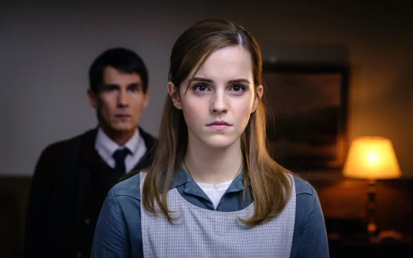 4K Ultra HD desktop wallpaper featuring Emma Watson in a scene from the movie Regression, highlighting her serious expression against a dimly lit background.