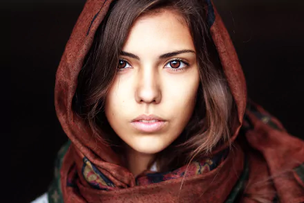 Close-up of a brunette woman with brown eyes, wearing a patterned scarf, captured in high definition as a PC desktop wallpaper and background.