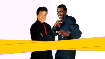 HD desktop wallpaper featuring Chris Tucker and Jackie Chan from the movie Rush Hour, with both stars posing against a simple background with yellow bands.