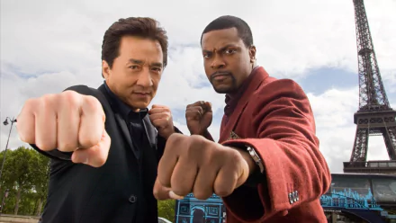 HD wallpaper featuring Chris Tucker and Jackie Chan striking action poses from the movie Rush Hour 3, with the Eiffel Tower in the background.