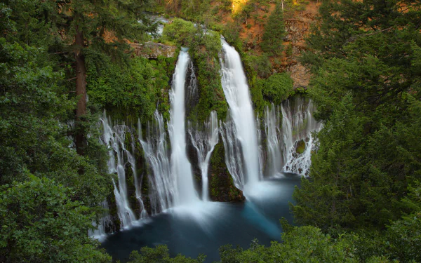 4K Ultra HD desktop wallpaper: Burney Falls at McArthur-Burney Falls Memorial State Park, California — lush forest and cascading waterfall plunging into a turquoise pool.