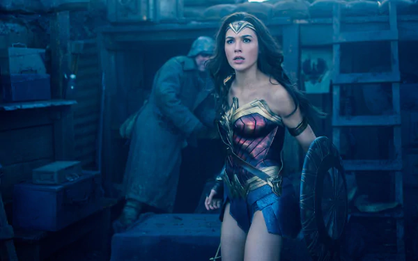 Gal Gadot as Wonder Woman in a movie scene, dressed in her iconic armor with a shield, in a tense environment. HD desktop wallpaper.