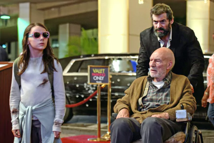 HD wallpaper featuring a scene from the movie Logan with Hugh Jackman as Logan, Patrick Stewart as Professor X in a wheelchair, and Dafne Keen as Laura Kinney (X-23).