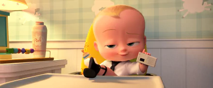 HD desktop wallpaper featuring Theodore Templeton, also known as Boss Baby from the movie The Boss Baby. The baby is seated with a confident expression, holding a toy gadget.