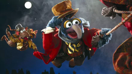 HD desktop wallpaper featuring Gonzo and Rizzo from the movie The Muppet Christmas Carol flying against a night sky with a full moon.