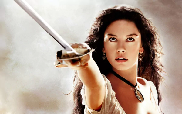 Catherine Zeta-Jones as Elena in The Legend of Zorro, featured in a dramatic HD desktop wallpaper with her holding a sword forward.