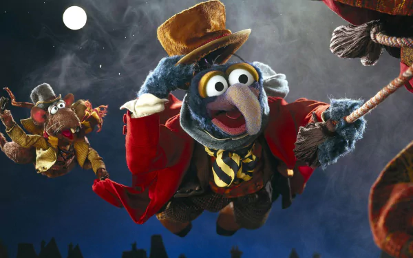 HD desktop wallpaper featuring Gonzo and Rizzo from the movie The Muppet Christmas Carol flying against a night sky with a full moon.
