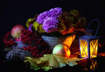 Still life HD wallpaper featuring a glowing lantern, bowl of chrysanthemums, apples, pine cones, berries, and autumn leaves in warm, low light photography.