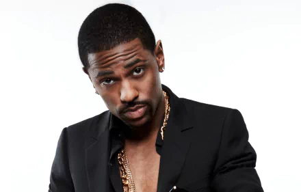 HD desktop wallpaper featuring a man in a black jacket with a gold chain.