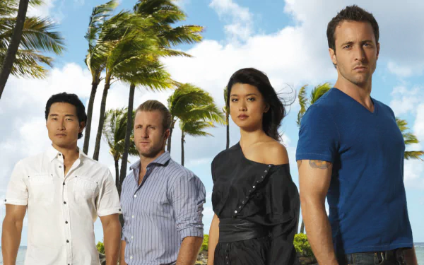 HD desktop wallpaper featuring the main cast of the TV show Hawaii Five-0 standing against a tropical backdrop with palm trees and a bright sky.