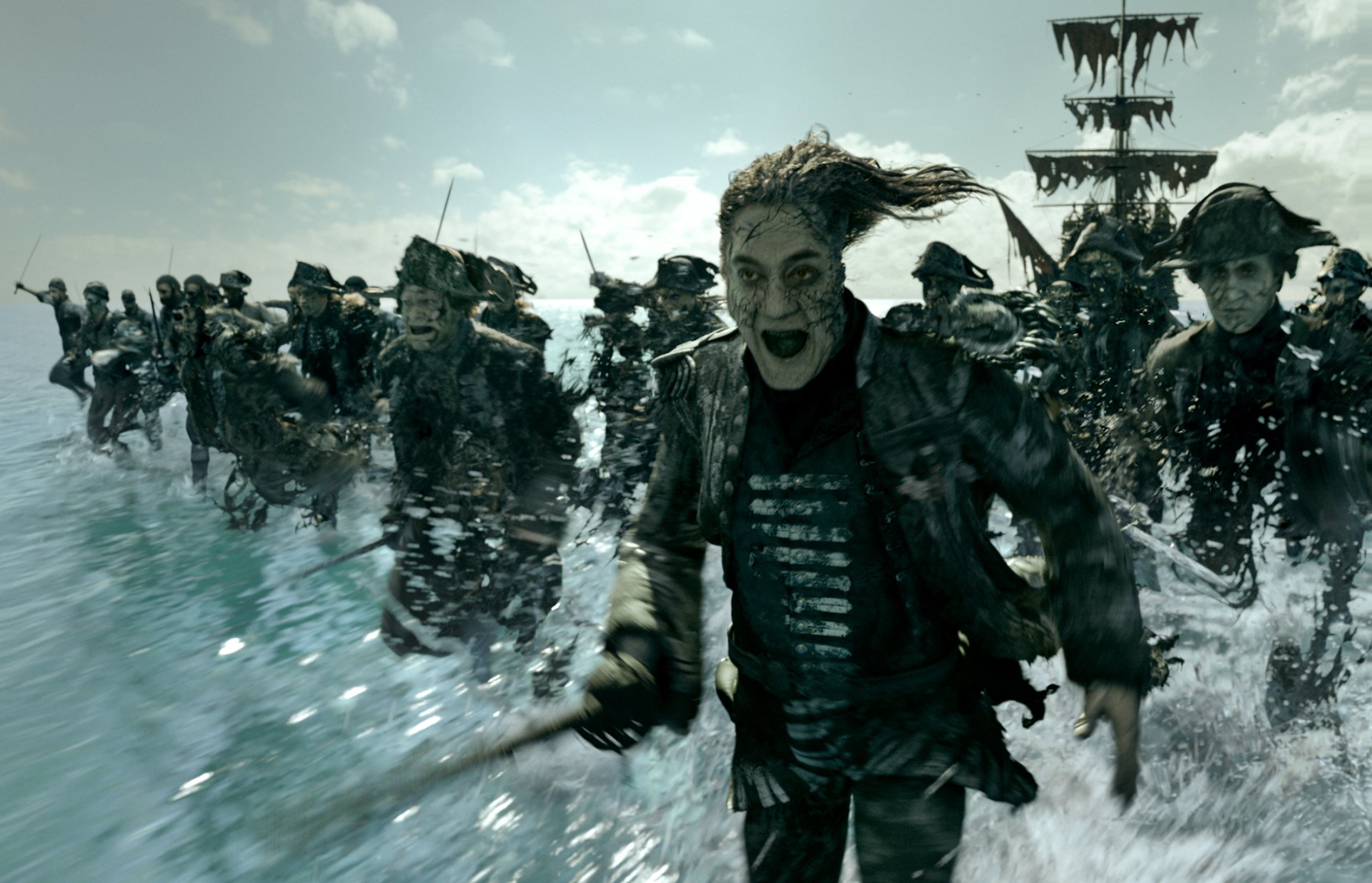 HD wallpaper of Captain Salazar (Javier Bardem) leading his ghostly crew across the sea in Pirates of the Caribbean: Dead Men Tell No Tales. The scene evokes a haunting, adventurous atmosphere.