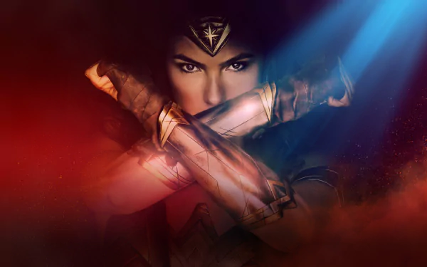 HD desktop wallpaper of Gal Gadot as Wonder Woman, showcasing her iconic pose with crossed arms in a dramatic lighting background.