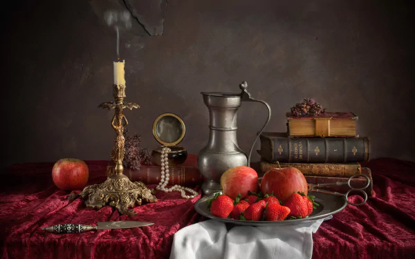 HD still life photography showcases a pearl necklace, lit candle, knife, books, metal pitcher, strawberries, and apples arranged on a red cloth, creating a classic desktop wallpaper.