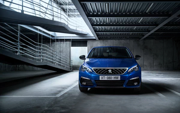 Blue Peugeot 308 vehicle centered in a concrete parking garage with dramatic lighting — 4K Ultra HD PC desktop wallpaper.