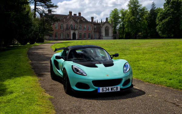 A mint green Lotus Elise supercar parked on a driveway in front of a historic mansion, captured in 4K Ultra HD as a PC desktop wallpaper and background.