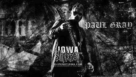 Black and white HD desktop wallpaper featuring Slipknot’s Paul Gray with a bass guitar, highlighting heavy metal, industrial metal, and nu metal themes from the album Iowa.