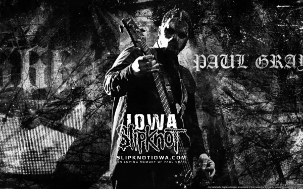 Black and white HD desktop wallpaper featuring Slipknot’s Paul Gray with a bass guitar, highlighting heavy metal, industrial metal, and nu metal themes from the album Iowa.