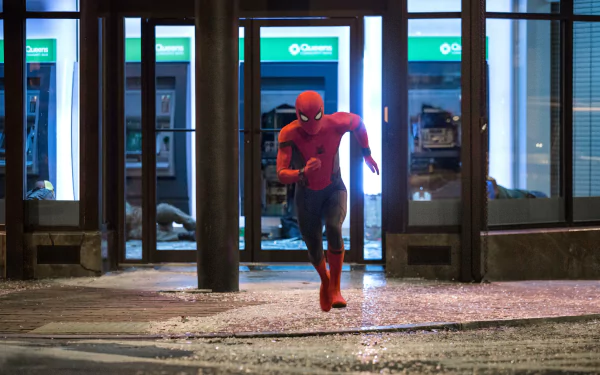 Spider-Man in action from the movie Spider-Man: Homecoming, depicted in a HD desktop wallpaper and background.