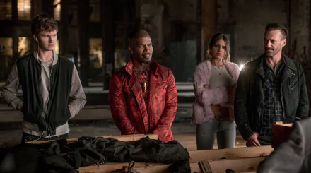 HD wallpaper featuring characters from Baby Driver, including actors Ansel Elgort, Jamie Foxx, Eiza Gonzalez, and Jon Hamm in a tense scene.