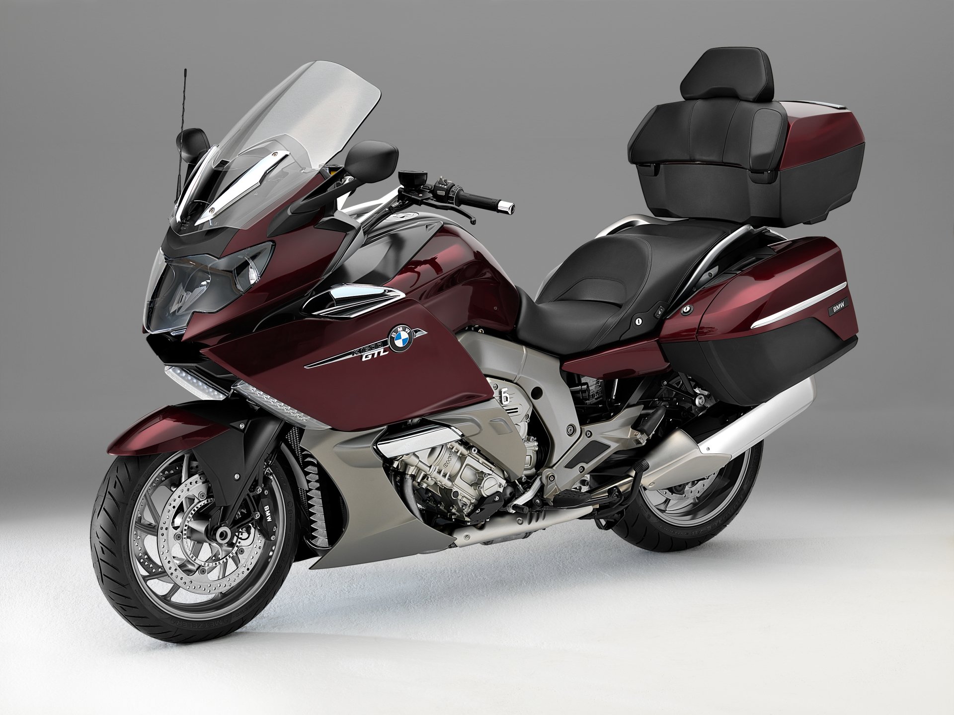 Maroon BMW K1600GT touring motorcycle on a neutral gray background — 2K Quad HD PC desktop wallpaper/background showcasing the BMW vehicle.