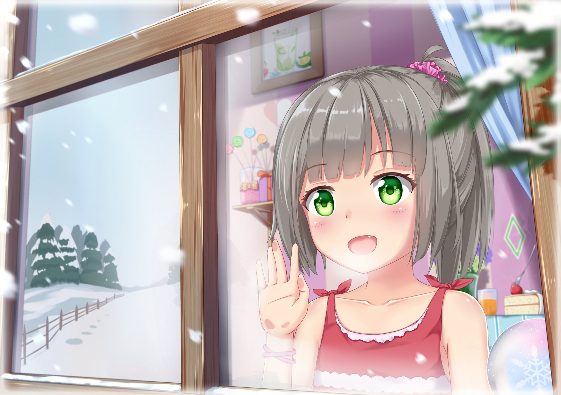 An adorable anime girl with grey hair, green eyes, and small fangs waves from inside a cozy room, with snow falling outside the window in this HD desktop wallpaper.