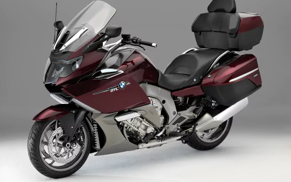 Maroon BMW K1600GT touring motorcycle on a neutral gray background — 2K Quad HD PC desktop wallpaper/background showcasing the BMW vehicle.