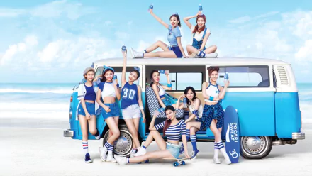 HD desktop wallpaper and background featuring TWICE, a music group, posing in front of a blue van on a beach under a clear sky.